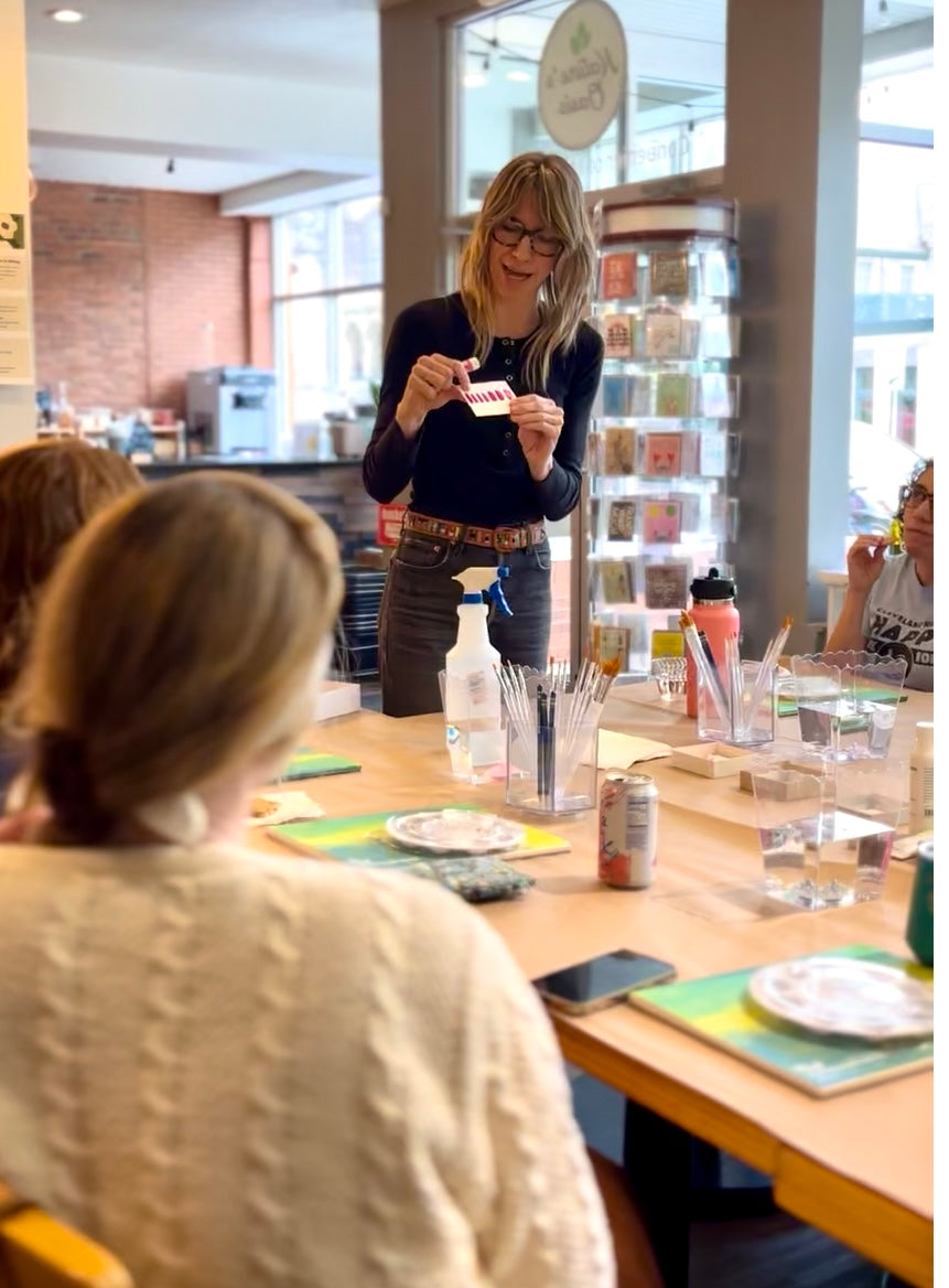 woman teaching an art class, adults learning and engaging in creative experiences